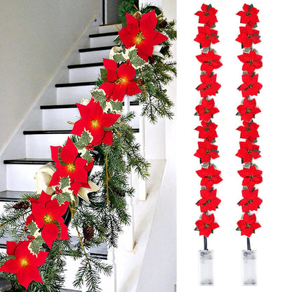 Guirnalda de flores de nochebuena con luces LED cálidas